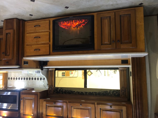 Cabinet with television and fireplace - finished