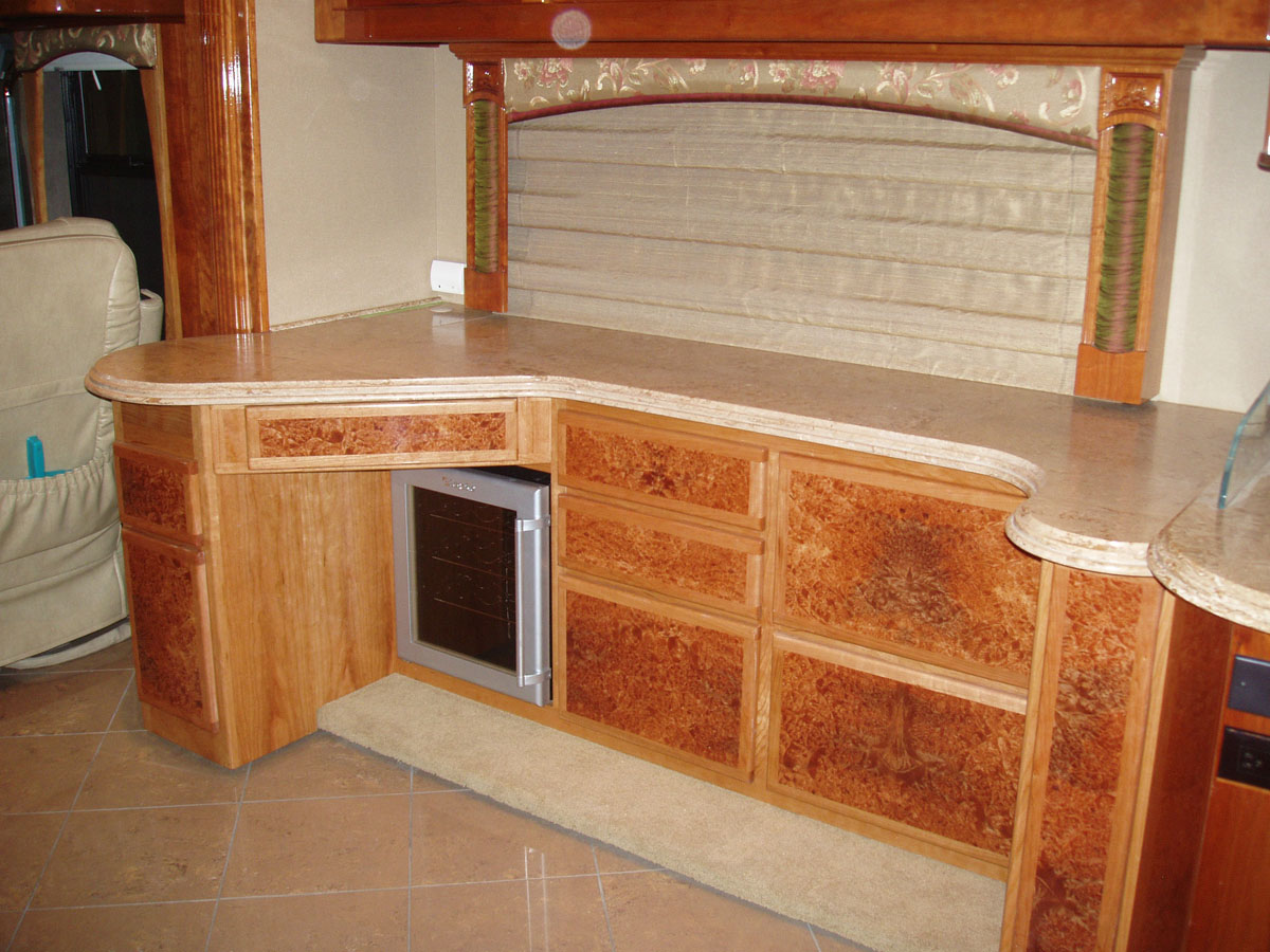 Custom cabinets with wine cooler and narrow pantry - alternate view
